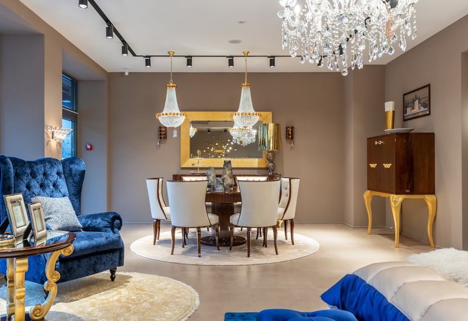 Vases on round table with chairs placed in spacious room with vintage cabinet and blue armchair on rug in apartment
